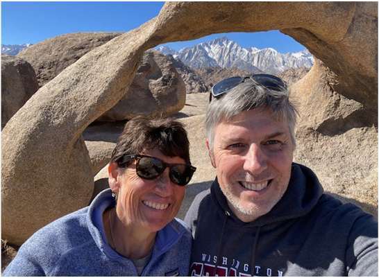 David Lawson and Dinorah hiking in the mountains