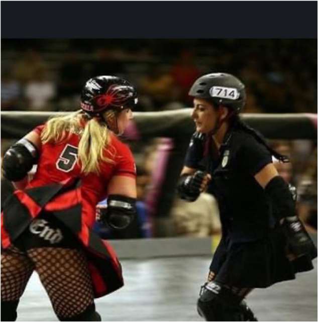Two roller derby skaters facing off