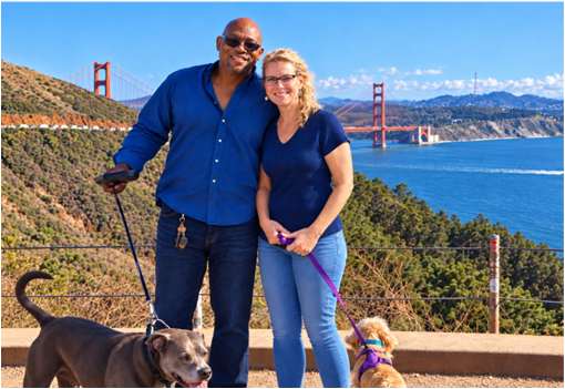 Sarah and Curtis with their dogs near the Golden Gate Bridge