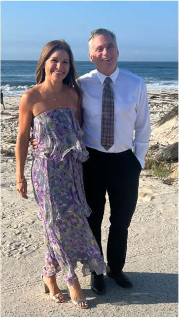 Stefanie Mazzei McGuinness with her husband by the ocean